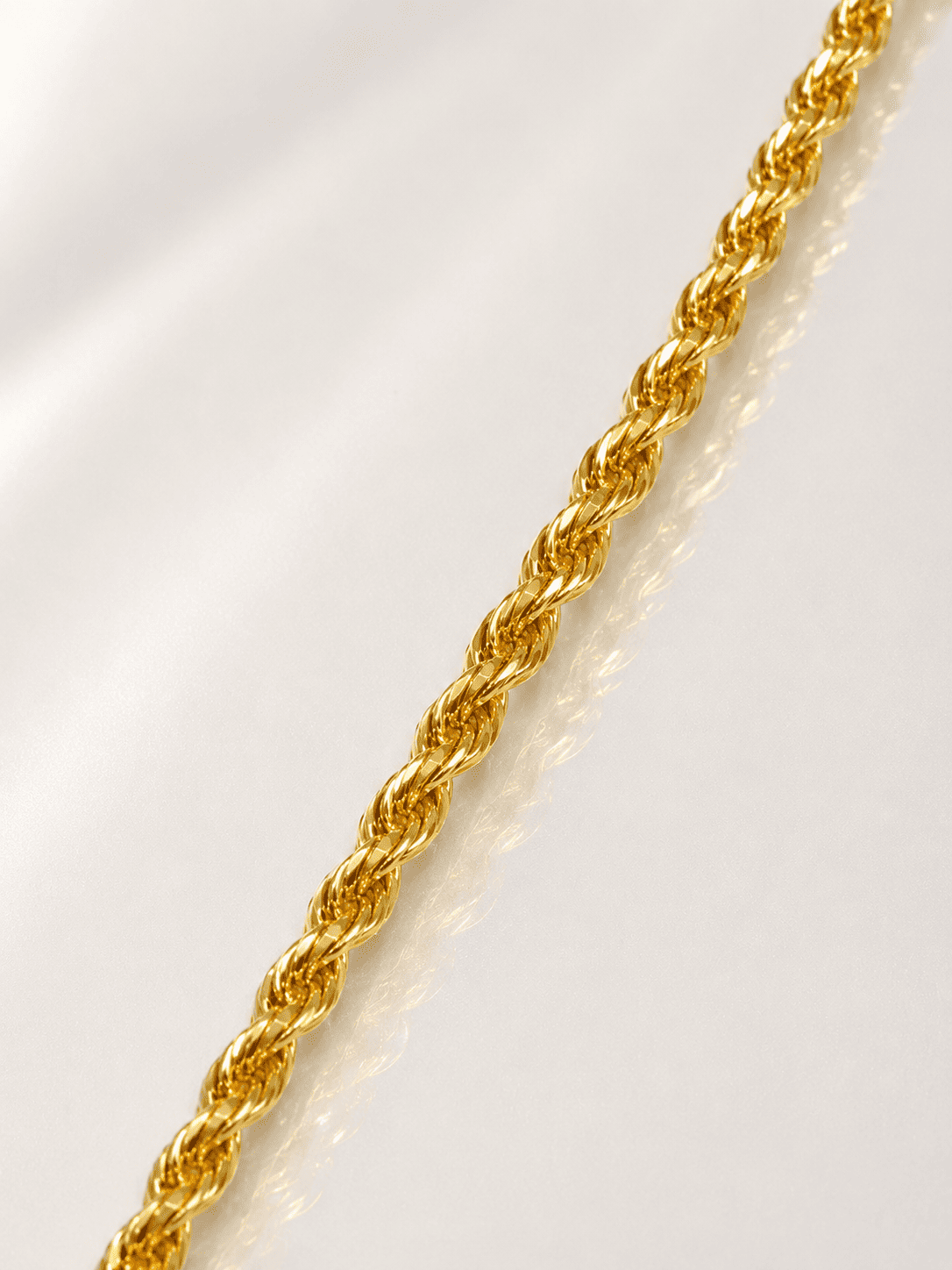 close up shot of gold plated rope chain for men 